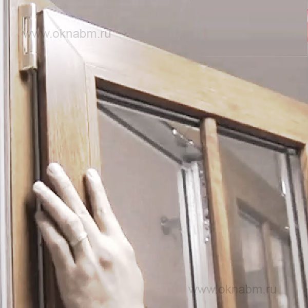 Press down on the top hinge