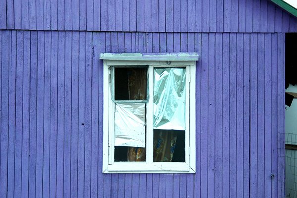 Old window with foil on glass